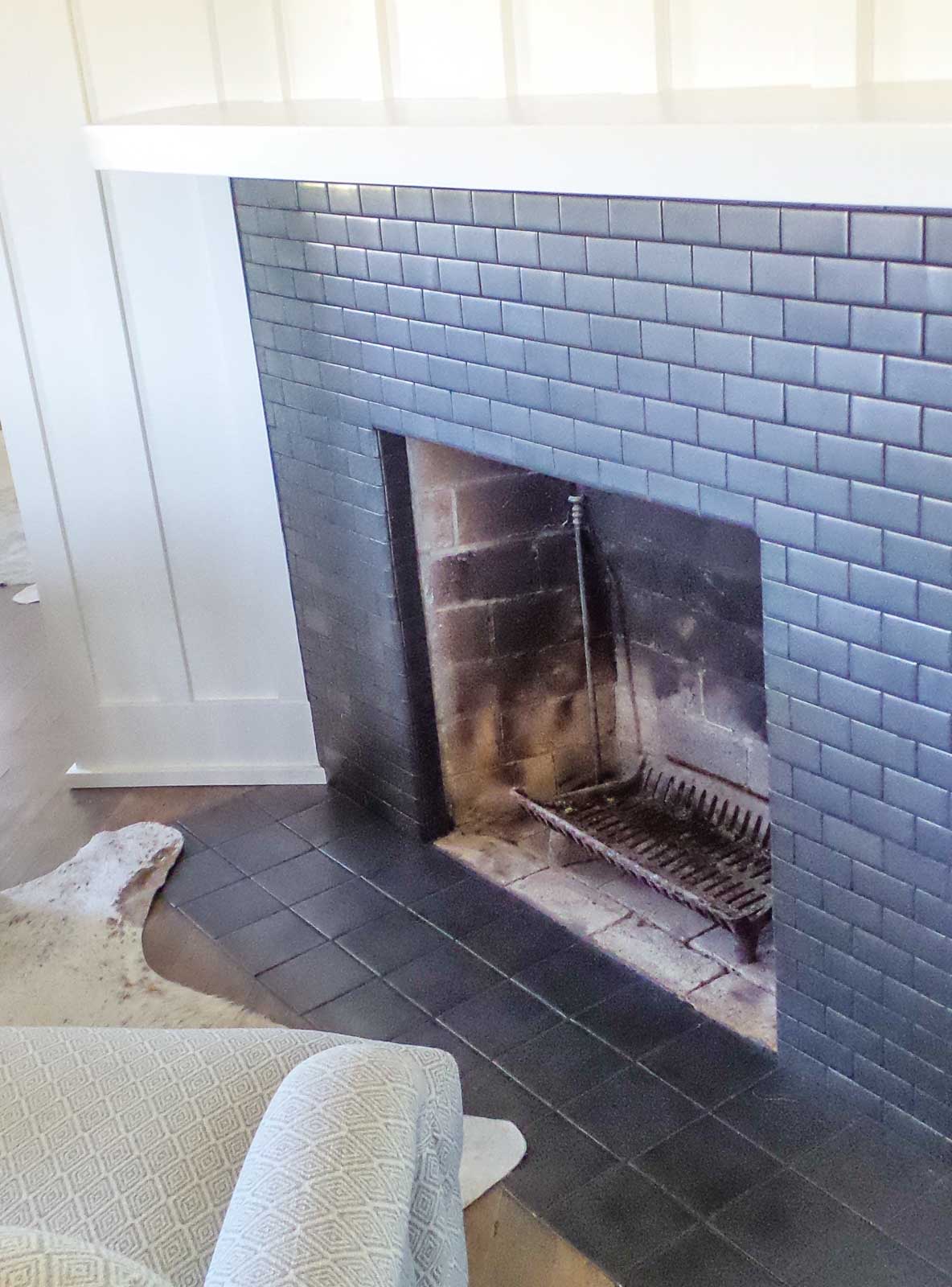 finished fireplace with dark gray tiles