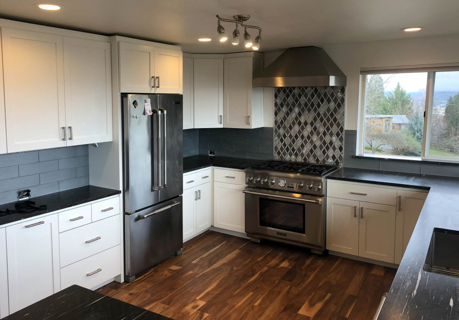 finished fireplace with dark gray tiles